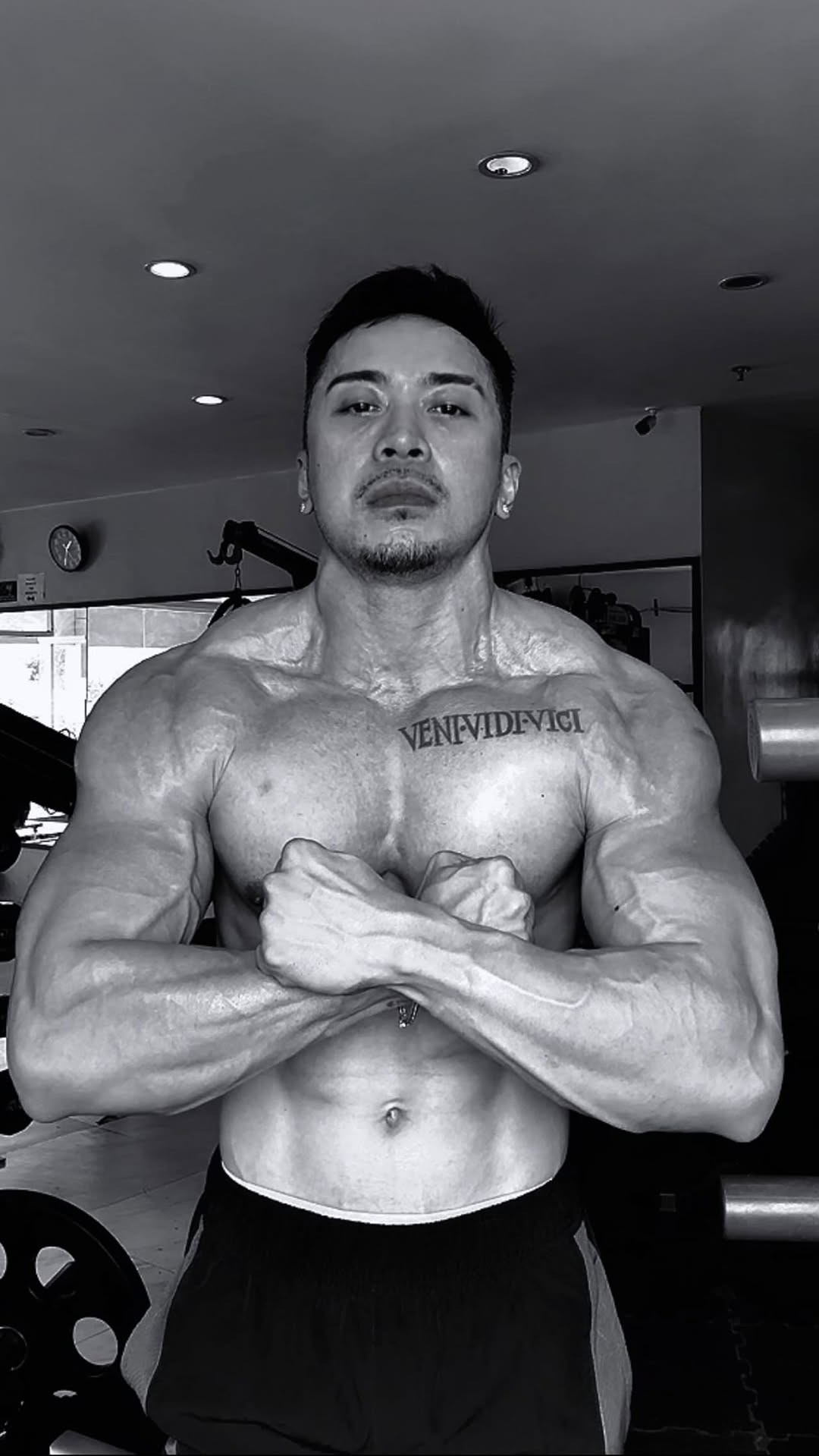 Charlie Leicester posing in the gym